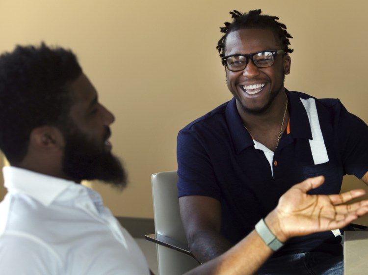 Rashon Nelson, left, and Donte Robinson, laugh during an interview in Philadelphia
Wednesday.