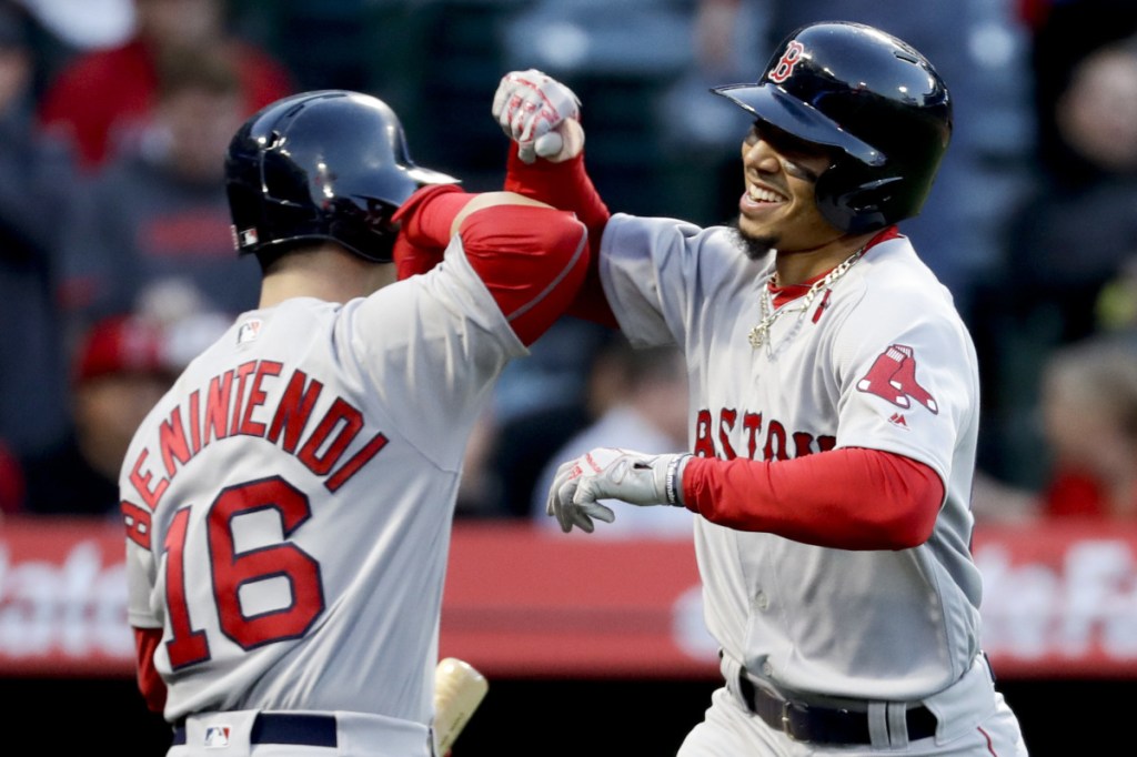 Mookie Betts, right, and Andrew Benintendi have been consistently aggressive at the top of the batting order, and it's paid off for the Boston Red Sox, who not only are off to their best start but one of the best in baseball over the past half-century.