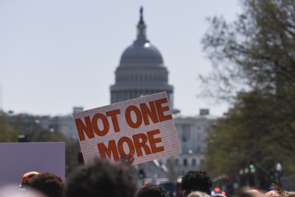 Hundreds of students march down Pennsylvania Avenue on Friday as part of a school walkout protesting gun violence. The demonstration came on the 19th anniversary of the Columbine, Colorado, high school  massacre.
