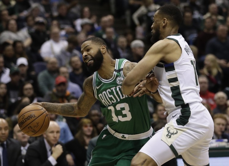 The Boston Celtics' Marcus Morris tries to drive past Milwaukee Bucks' Jabari Parker during the second half of Game 3 of their first-round playoff series Friday in Milwaukee. (AP Photo/Morry Gash)