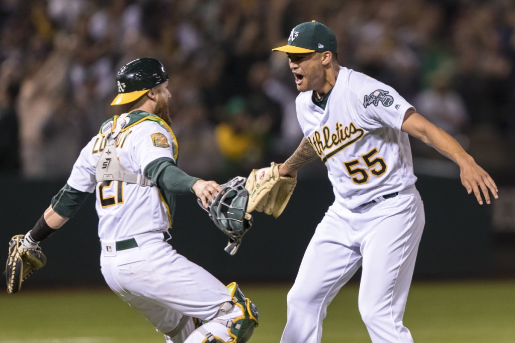 Athletics pitcher Sean Manaea, right, celebrates with catcher Jonathan Lucroy after pitching a no-hitter against the Boston Red Sox on Saturday night in Oakland, Calif. The A's won 3-0.