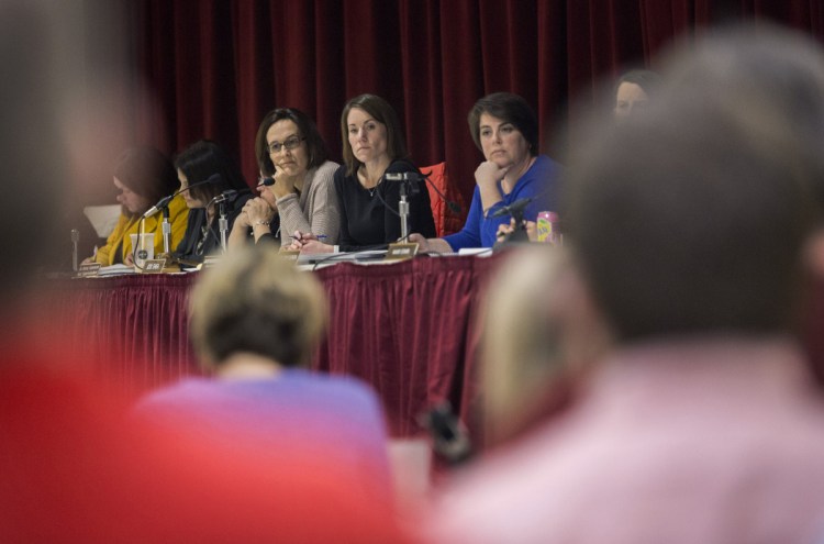 At a special meeting of the board of education last month, Scarborough Superintendent Julie Kukenberger, center, listens to arguments about changing school start times, one of the policy issues linked to a conflict between the superintendent and high school Principal David Creech.