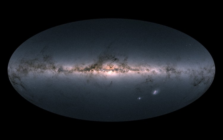 This image provided by the European Space Agency ESA, is Gaia's all-sky view of our Milky Way Galaxy and neighboring galaxies, based on measurements of nearly 1.7 billion stars. The map shows the total brightness and colour of stars observed by the ESA satellite in each portion of the sky between July 2014 and May 2016. (ESA via AP)