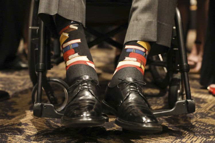 Former President George H.W. Bush wore socks designed as a tribute to his wife, Barbara Bush, during her funeral service in Houston on Saturday. Barbara Bush was known for bringing awareness to AIDS patients and for her work promoting literacy, which her husband subtly honored by wearing socks printed with blue, red and yellow books.