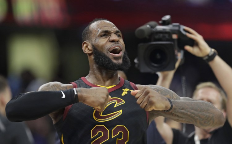 LeBron James celebrates after hitting the game-winning shot in the second half of Game 5 of Cleveeland's first-round playoff series against the Indiana Pacers. The Cavaliers won 98-95 and lead the series, 3-2.