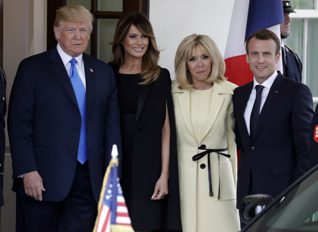 President Trump and first lady Melania Trump greet French President Emmanuel Macron and his wife, Brigitte Macron, Monday at the White House in Washington.