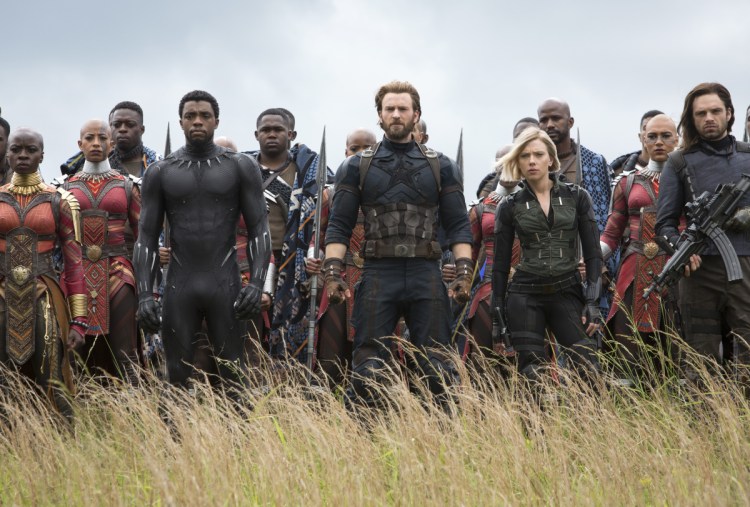Danai Gurira, left, Chadwick Boseman, Chris Evans, Scarlett Johansson and Sebastian Stan in "Avengers: Infinity War," the 19th film from Marvel Studios.