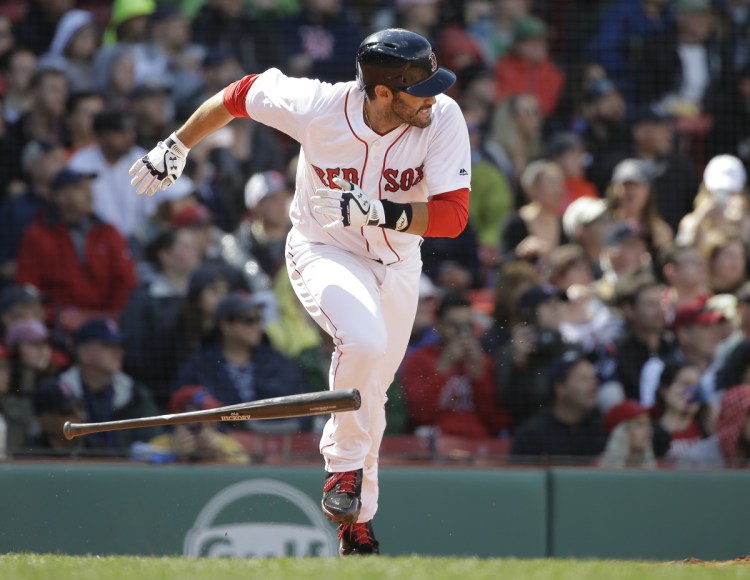Boston's J.D. Martinez runs to first after hitting a two-run single in the sixth inning of the Red Sox' 4-3 win over Tampa Bay on Sunday in Boston.