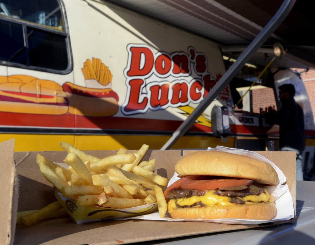 Double cheeseburger called the "Big One" and french fries served at Don's Lunch Van on Main Street in Westbrook.