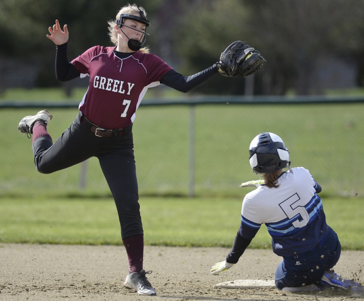 Sawyer Dusch of Greely attempts to put the tag on Lexi York, who stole second base for York, which put the game away with a four-run seventh inning.