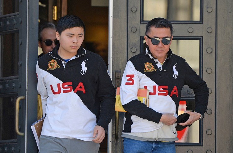 Princehoward Yee and his father, Howard Yee, leave the federal courthouse in Portland on Wednesday. Howard Yee sued Deering High School Principal Gregg Palmer over Palmer's decision to not let Princehoward play baseball. 