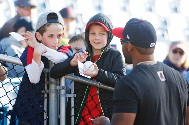 Spencer Carman, 9, and Nate Carman, 8, of Arlington, Mass., didn’t get to see a baseball game Saturday afternoon because Hadlock Field was too wet. It wasn’t a total loss, they did score an autograph from Sea Dogs first baseman Josh Ockimey.