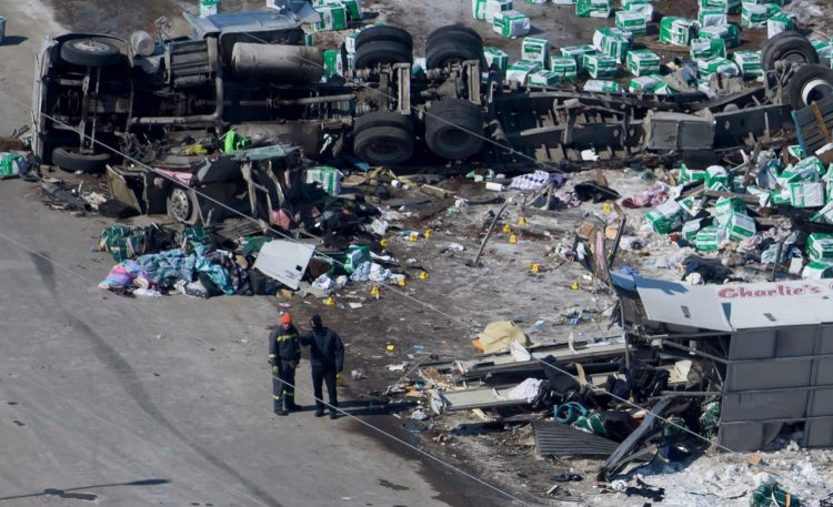 The wreckage of a fatal crash outside of Tisdale, Saskatchewan, is seen Saturday. A bus carrying the Humboldt Broncos hockey team crashed with a truck en route to Nipawin for a game Friday night.