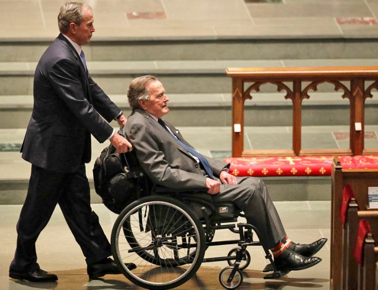 Former Presidents George W. Bush, left, and George H.W. Bush arrive at St. Martin's Episcopal Church for the funeral service for former first lady Barbara Bush, Saturday in Houston. 