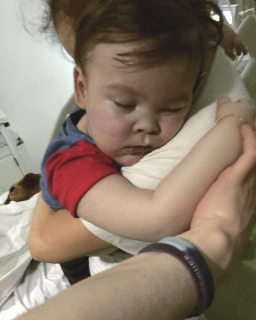  Brain-damaged toddler Alfie Evans cuddles his mother, Kate James, at Alder Hey Hospital, Liverpool, England. The father of the boy said the child is surviving after being taken off life support, surprising doctors who had argued he should be allowed to die. 