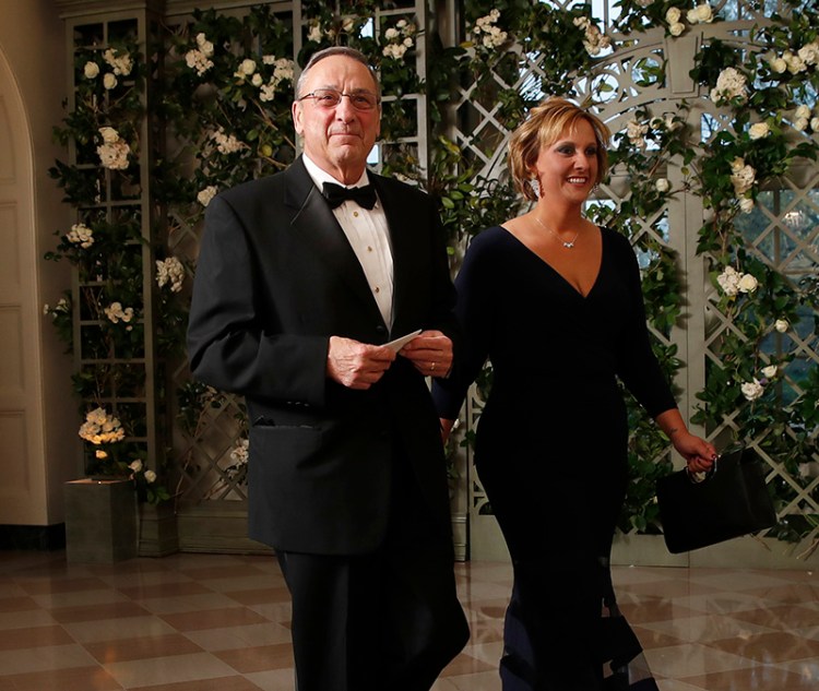 Gov. Paul LePage his daughter, Lauren,  arrive for the state dinner in honor of French President Emmanuel Macron on Tuesday.