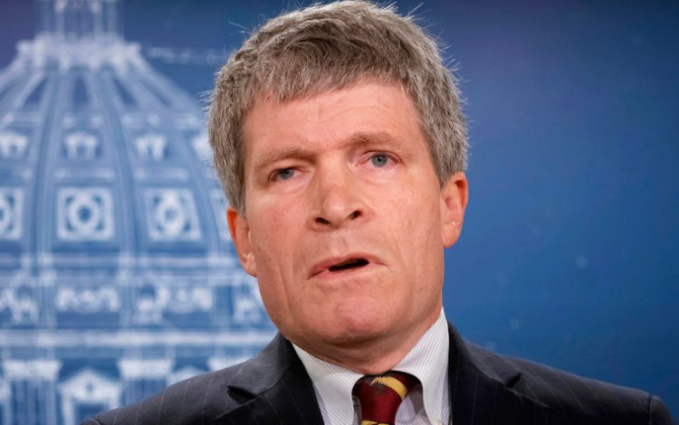 Former Republican White House lawyer in President George W. Bush's administration Richard Painter announces his candidacy for U.S. Senate as a Democrat in St. Paul, Minn., Monday.