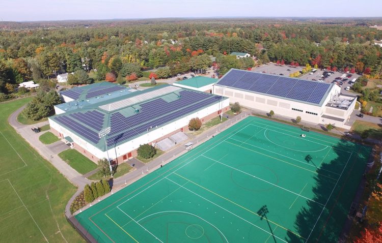 Rooftop solar panels are shown on Bowdoin College's Sidney J. Watson Ice Arena and Farley Field House in a photo shot by a drone in 2015. The college announced Thursday that it is now carbon neutral.