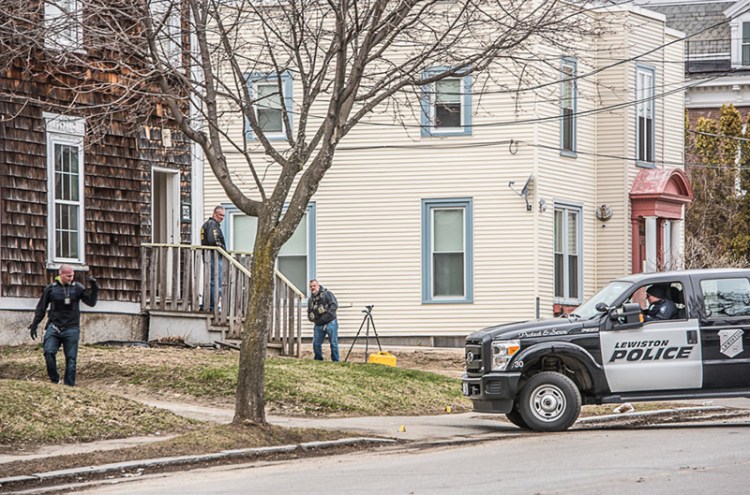 Police investigate a shooting near 126 College Street in Lewiston on Saturday afternoon. 