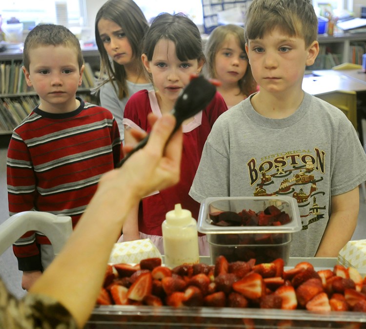Mt. Vernon Elementary School first-graders line up for a bowl of strawberries and beets in 2015 in Linda Smith's classroom.  