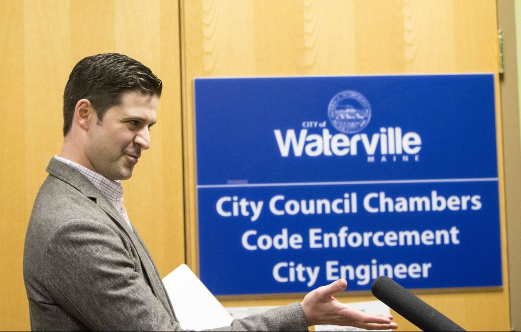 Waterville Mayor Nick Isgro evades reporters' questions about his recent social media controversy Tuesday night before a city budget meeting, calling the reports "fake news." 