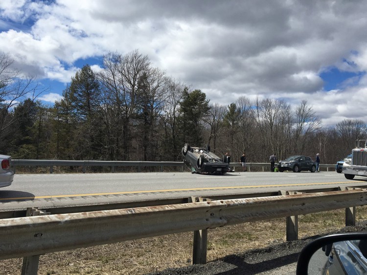 A car rolled over on the Maine Turnpike near Falmouth on Friday.