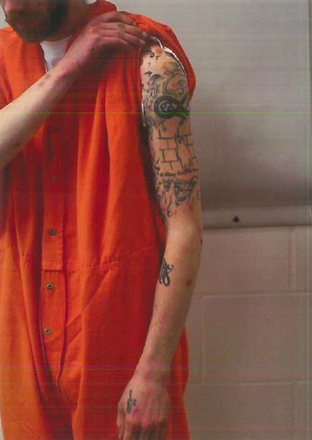 The FBI released this photo of John Williams' tattoos. Williams, 29, is suspected of killing Cpl. Eugene Cole of the Somerset County Sheriff's Department.