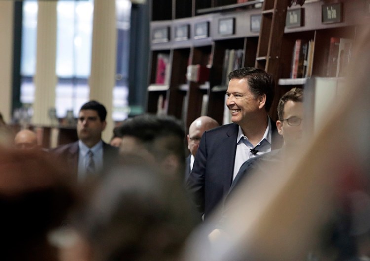 Former FBI director James Comey arrives at a New York bookstore.