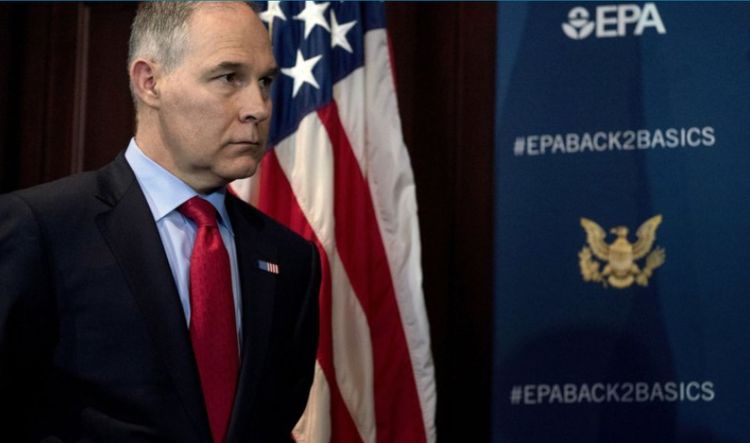 A sign criticizing EPA Administrator Scott Pruitt is seen posted in Washington on Friday. 