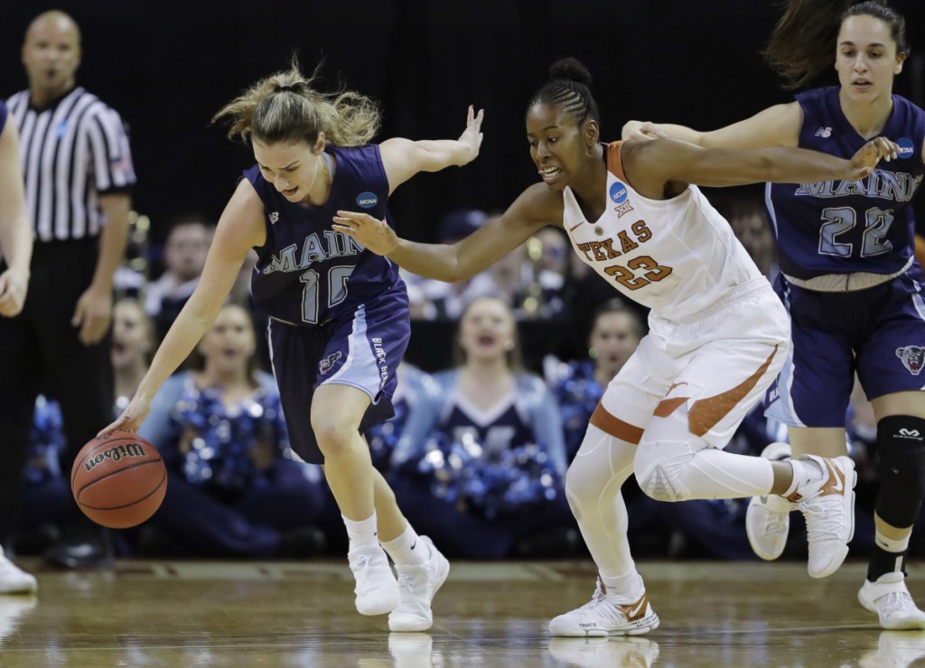 Maine guard Julie Brosseau, left, moves the ball upcourt past Texas guard Ariel Atkins during the NCAA women's basketball in March. (AP Photo/Eric Gay)