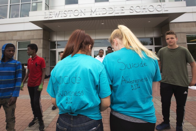 Lewiston Middle School students take part in an anti-bullying protest last May to mark a seventh-grader's death by suicide. School is where a young person's vulnerabilities are often most easily exacerbated.