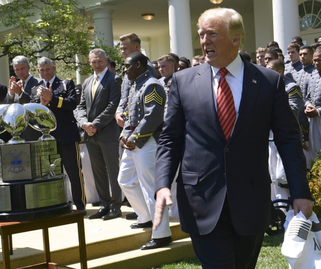 President Trump walks off of the stage Tuesday after speaking in the White House Rose Garden during an event to present the Commander-in-Chief's Trophy to the U.S. Military Academy football team.
