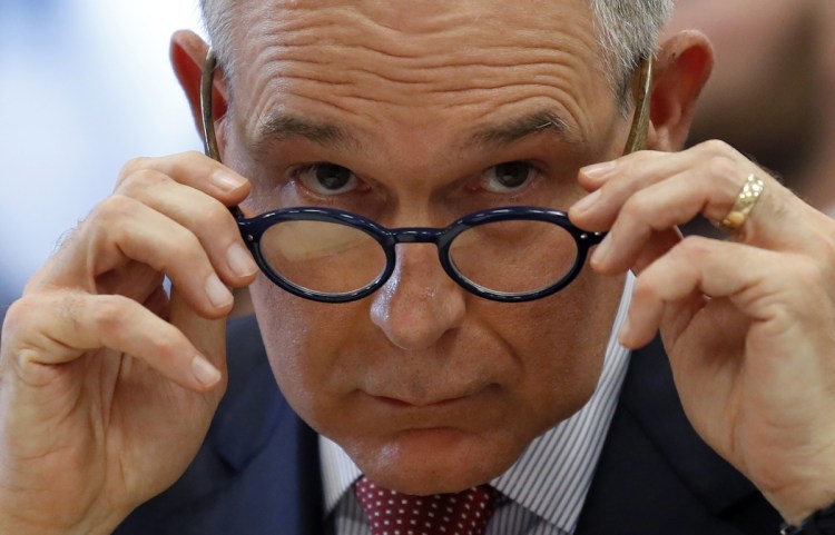 Environmental Protection Agency Administrator Scott Pruitt removes his glasses as he testifies at a hearing of the House Appropriations subcommittee for the Interior, Environment, and Related Agencies, on Capitol Hill, Thursday, April 26, 2018 in Washington. (AP Photo/Alex Brandon)