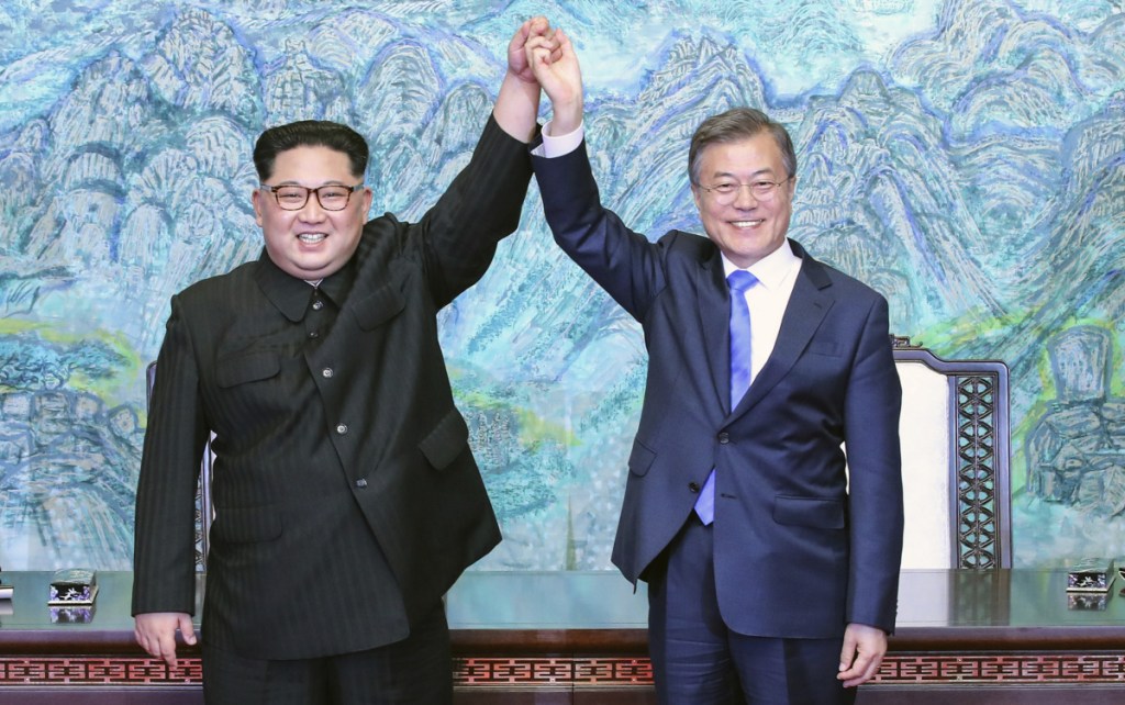 North Korean leader Kim Jong Un, left, and South Korean President Moon Jae-in raise their hands after signing a joint statement at the border village of Panmunjom in the Demilitarized Zone, South Korea, on April 27. An armistice halted the Korean War, but no treaty was signed.