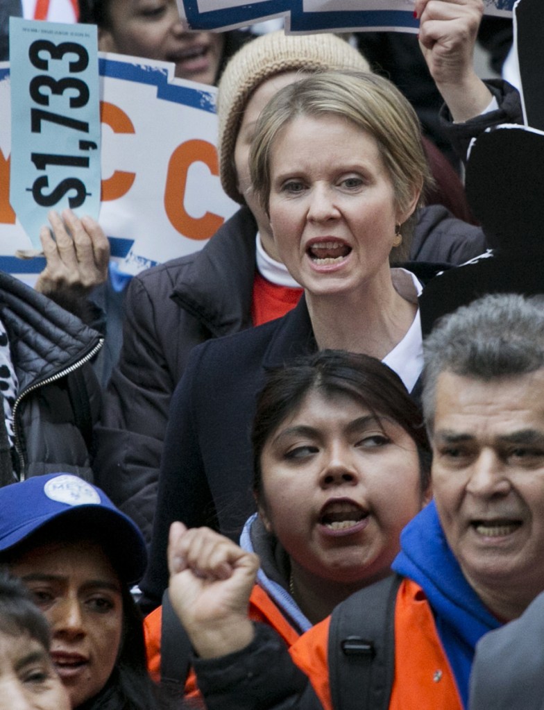 Democratic gubernatorial candidate Cynthia Nixon, center, joins a May Day rally Tuesday  in New York.
