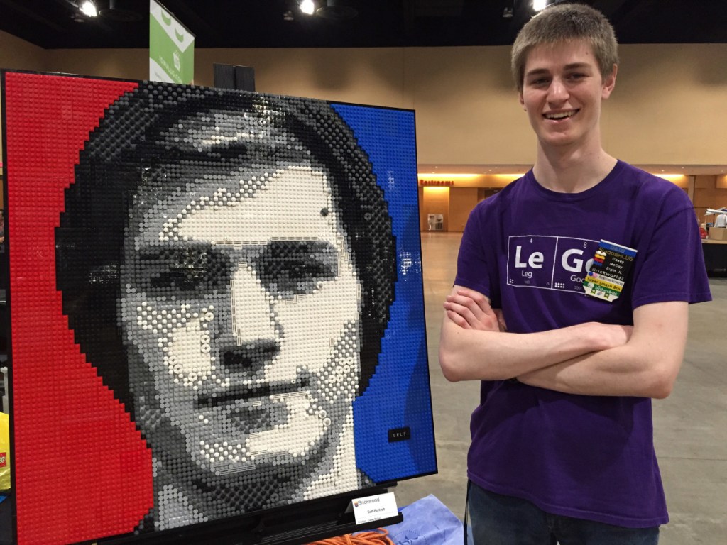 Associated Press/Marcia Dunn
Chicago-area college student Casey McCoy stands last June with the self-portrait he created from more than 3,000 Lego bricks. This year's convention is June 13-17.