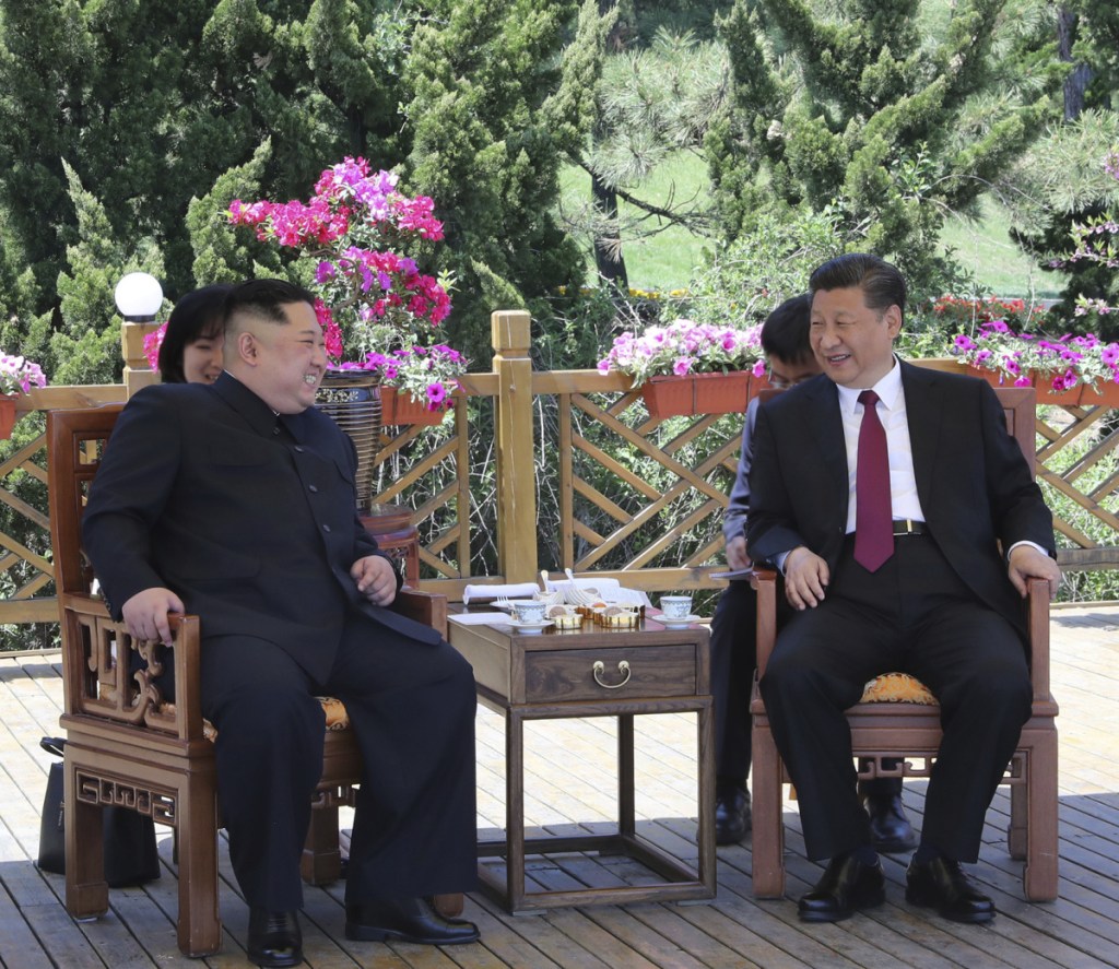 Chinese President Xi Jinping, right, speaks to North Korean leader Kim Jong Un in Dalian in northeastern China's Liaoning Province earlier this week.