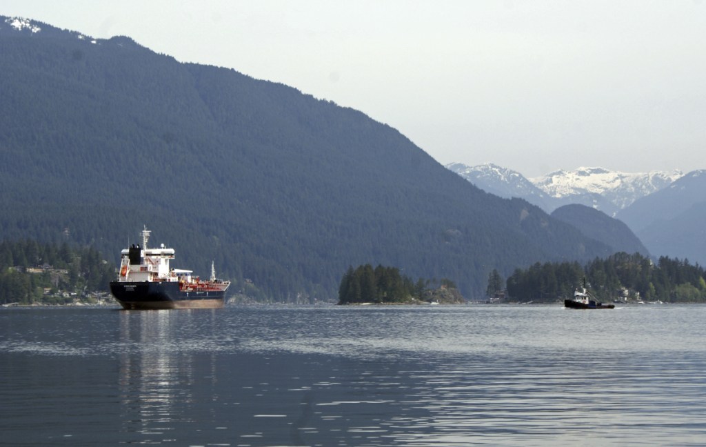 An oil tanker is anchored last week off the Kinder Morgan Inc. Westridge oil terminal in Vancouver, British Columbia, at the end of the Trans Mountain pipeline that begins in northern Alberta. A proposed expansion would triple the capacity of the existing pipeline to ship oil across the Canadian Rockies and to the Pacific Ocean, resulting in a sevenfold increase in the number of tankers operating in an area dependent on tourism and fishing.