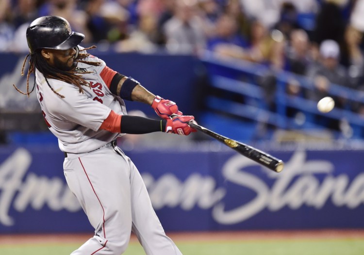 Boston's Hanley Ramirez hits a two-run home run in the third inning of a 5-2 win over the Blue Jays on Saturday in Toronto.