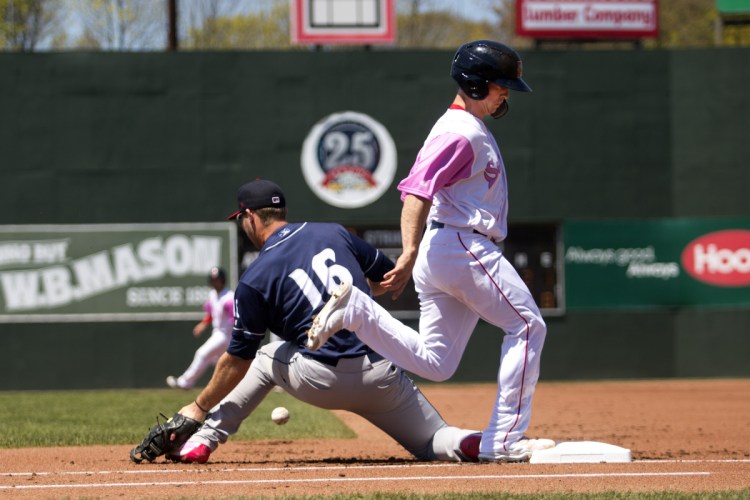 Portland's Tony Renda makes it to first base as Binghamton's Peter Alonso fails to field a throw during the Sea Dogs' 10-4 loss Sunday at Hadlock Field in Portland. May 13