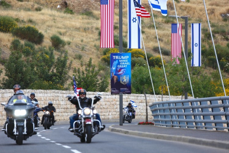 Members of a motorcycle club arrive on a road leading to the new U.S. Embassy in Jerusalem during a group ride Sunday from the site of the old embassy in Tel Aviv. Both sides of the Israeli-Palestinian conflict claim Jerusalem as a capital.