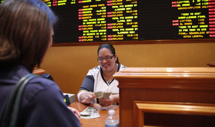 Soon much of the country will see a sight that's so common in Nevada but nowhere else in the nation – a teller paying off successful bettors as rows of point spreads line a wall.