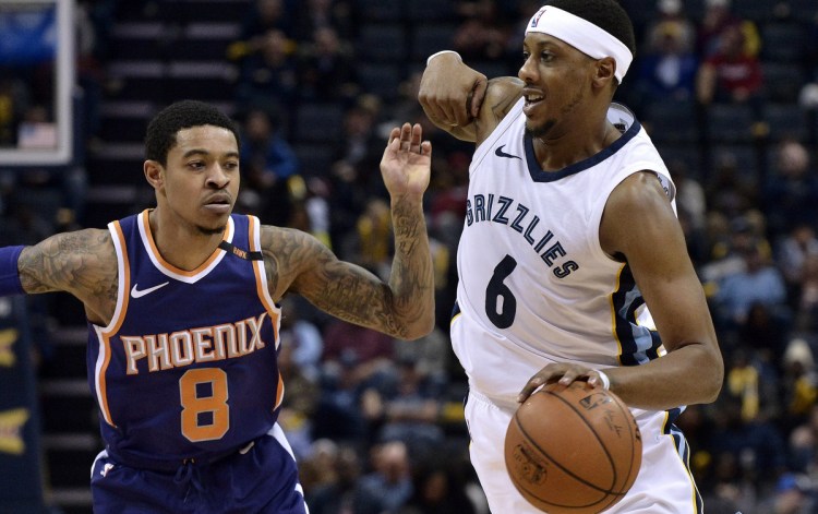 Memphis guard Mario Chalmers drives by Phoenix guard Tyler Ulis during a game on Jan. 29 that had a big impact on the race for the NBA's worst record.