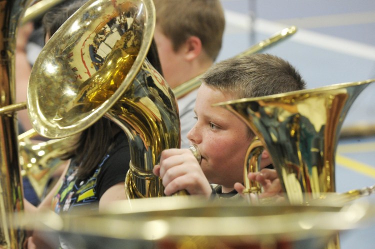 Young musicians rehearse at the Riverton school in Portland during the District 2 Elementary Music Festival in 2010. A letter writer warns that cutting the school budget threatens music programs.