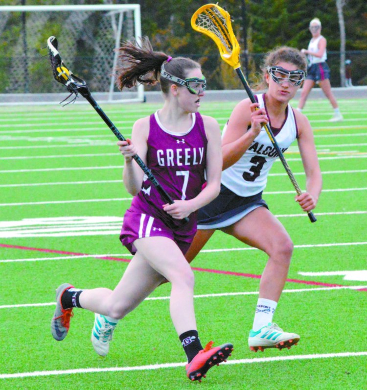 Greta Van Curan of Greely carries the ball down the field while being pursued by Freeport's Allison Greuel during Greely's 13-10 lacrosse victory Wednesday.