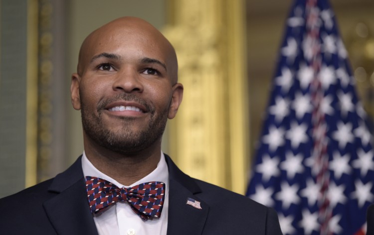 Dr. Jerome Adams waits to be sworn in as the 20th U.S. Surgeon General in 2017.