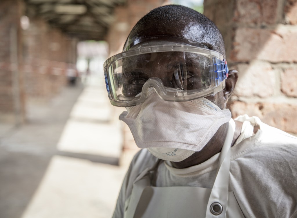 A health worker wears protective clothing outside an isolation ward for Ebola patients at Bikoro Hospital, in the rural area of Congo where the outbreak was reported.
Mark Naftalin/UNICEF via AP