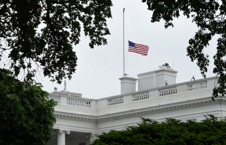 The American flag is lowered to half-staff at the White House in Washington on Friday to honor the victims in the shooting at Santa Fe High School in Texas. Some social-media watchers were surprised at the speed with which the Santa Fe shooting descended into information warfare, including a fake Facebook account in which the suspect's photo was manipulated to make it look like he was wearing a hat supporting Hillary Clinton.