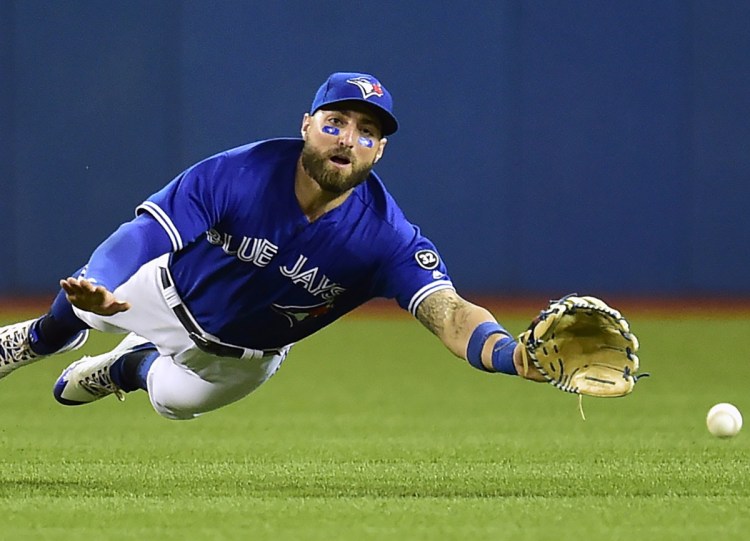Toronto's fielder Kevin Pillar can't make it to a fly ball hit for a double by Oakland's Jed Lowrie in Friday's game at Toronto. Oakland won 3-1.