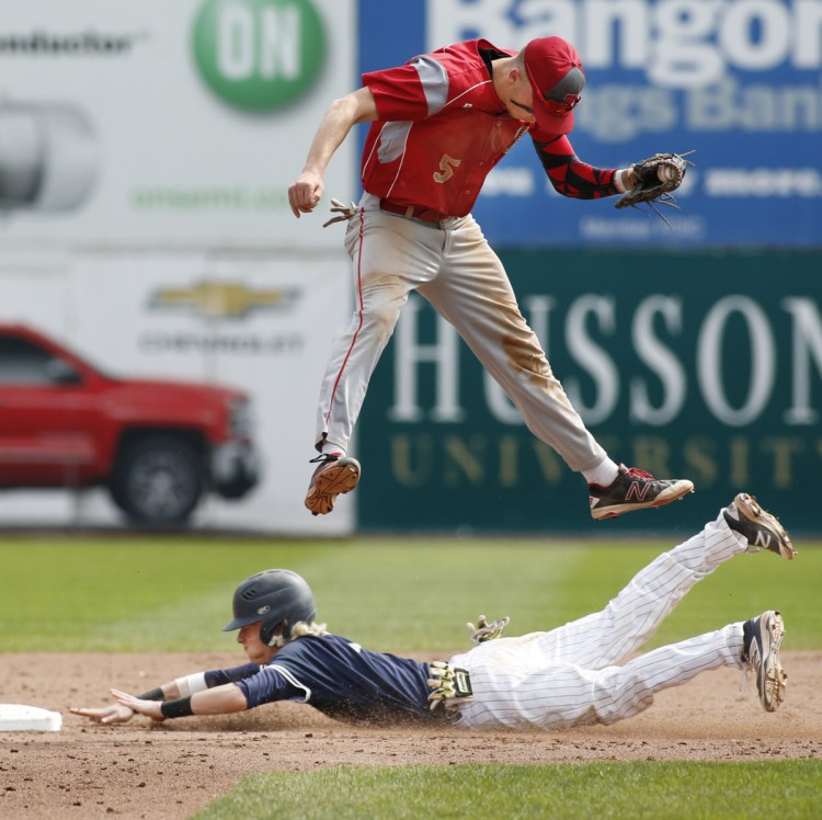 Camren King of Portland steals second base in the fourth inning Saturday as Riley Hasson of South Portland leaps for the throw. South Portland was held hitless until the fifth inning but scored four runs in the final two innings to ralliy for a 4-1 victory – its seventh in a row.